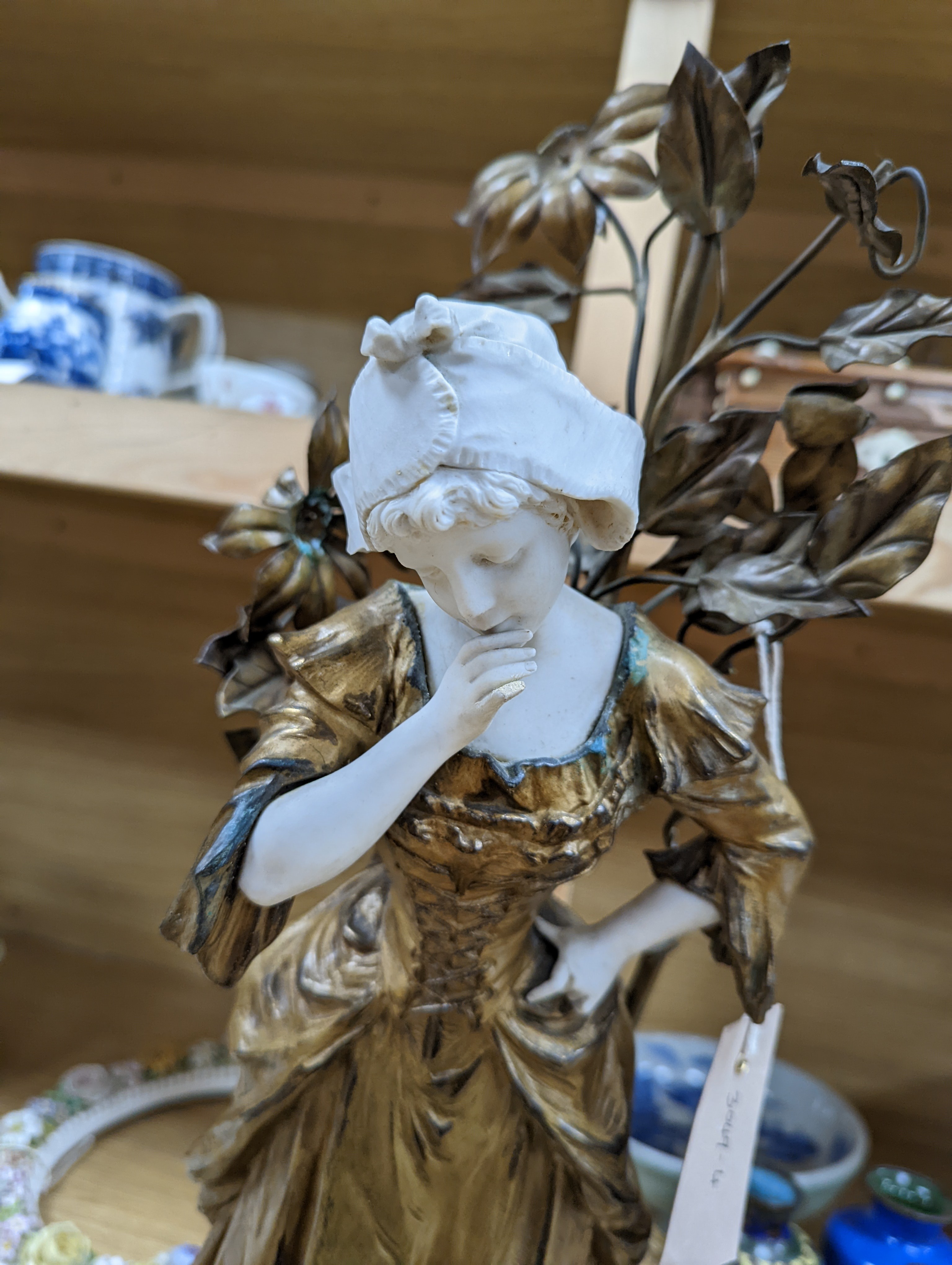 A late 19th Century French gilt spelter and bisque porcelain figure after Mednat 54cm